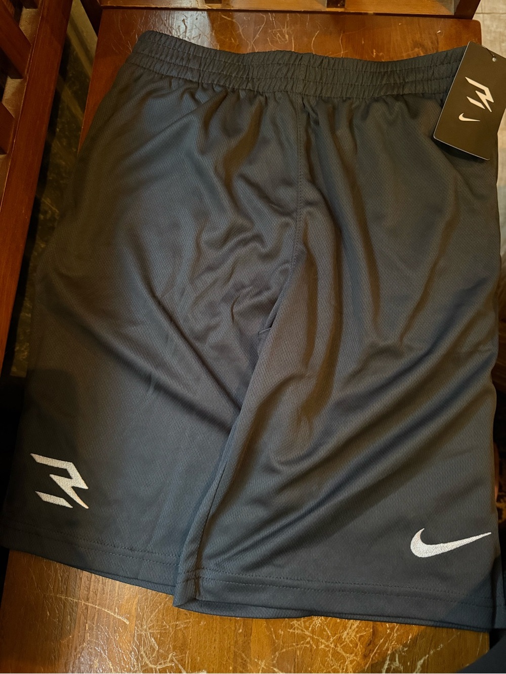Nike dark gray Boys' Athletic Shorts with White Logos